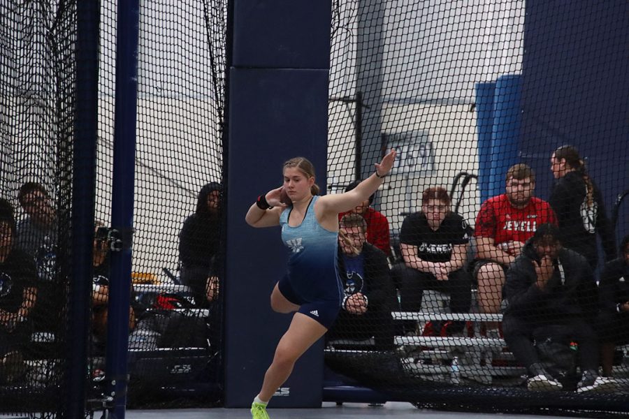 Adriel Holloway, freshman in music performance, turns before throwing the shot put. Holloway threw 12.06 meters in the shot put event and 17.23 meters in the weight throw, passing the NCAA Division II provisional standard of 17.00 meters. 