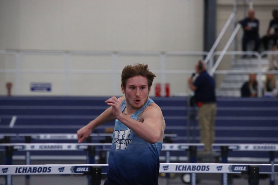 Tommy Lancaster, freshman in criminal justice, sprints toward a hurdle in the 60-meter hurdle prelims. Lancaster finished with a time of 9.20 seconds.