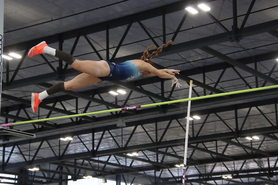Rachael Mayberry, graduate pole vaulter, flies over the bar in the pole vault event. Mayberry won the event with a top height of 3.62 meters.