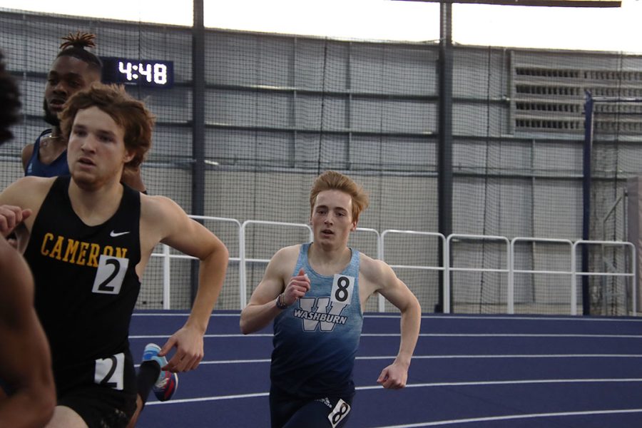 Kael Ecord, junior in mathematics, races around the track in the 800-meter run. Ecord also participated in the men’s 4x400-meter relay, where Washburn’s team took seventh place with a time of 3:30.46.
