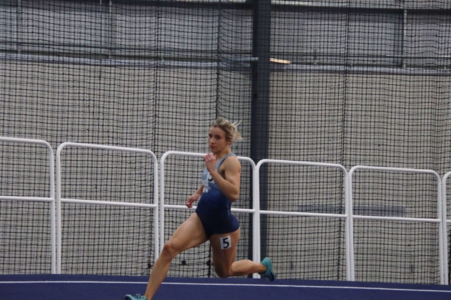 Isabella Hohl, junior in marketing, sprints around the track in the 200-meter dash. Hohl achieved provisional marks of 24.58 seconds in the 200-meter dash and 7.46 seconds in the 60-meter dash.