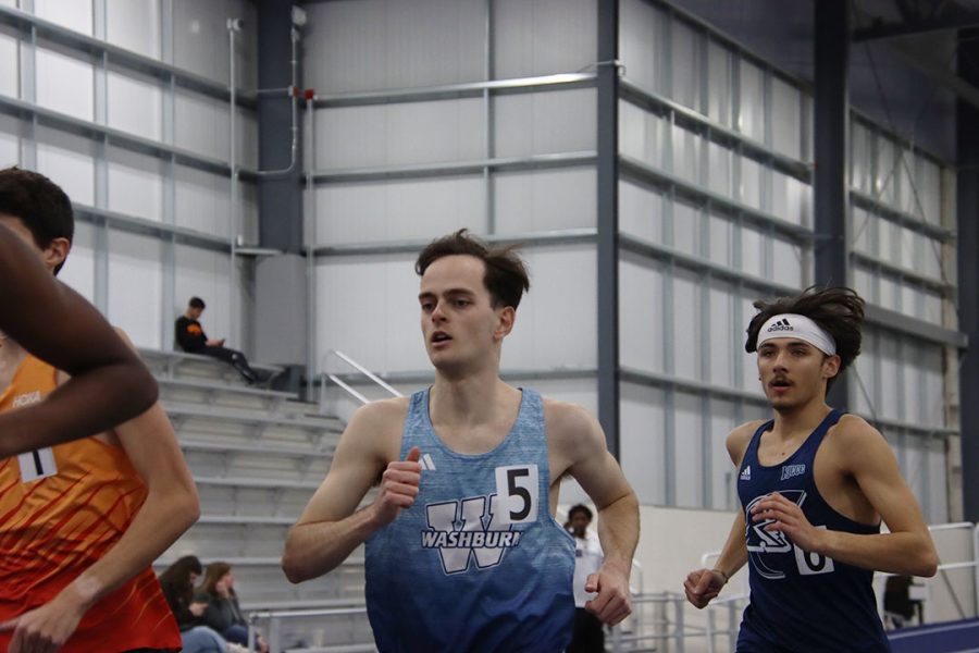 Leo Cossham, a graduate in the MBA program, runs around the track in the 3000-meter run. Cossham finished the event with a time of 8:40.13.