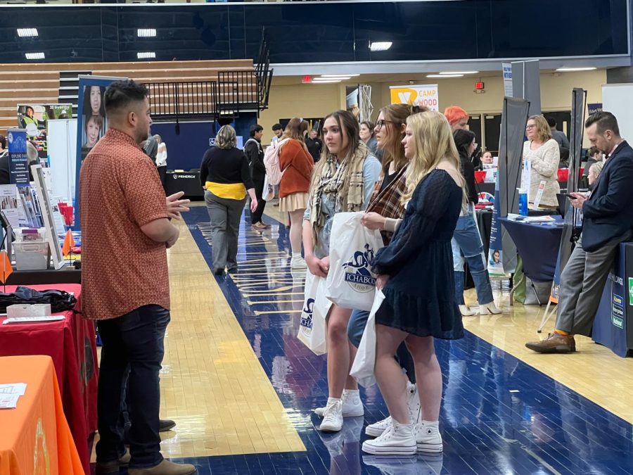 Employer speaks with students and introduce their organizations. This semester’s career fair held 140 organizations, including graduate schools looking to recruit Washburn students.