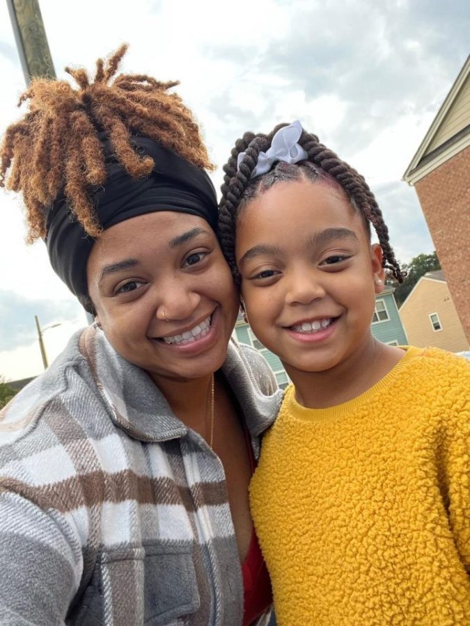 Lexi Cunningham, senior in the Human Service Graduate program, smiles with her daughter. They both take it each day at a time. 
