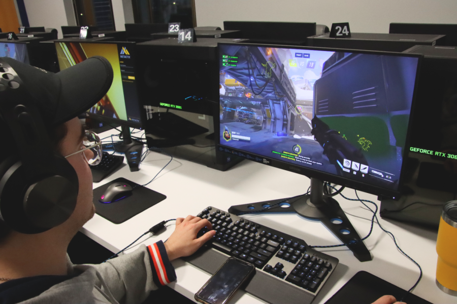 Colton Cattoor, freshman in biology, practices for the Esports team for “Overwatch.” He played with two other members in practice.