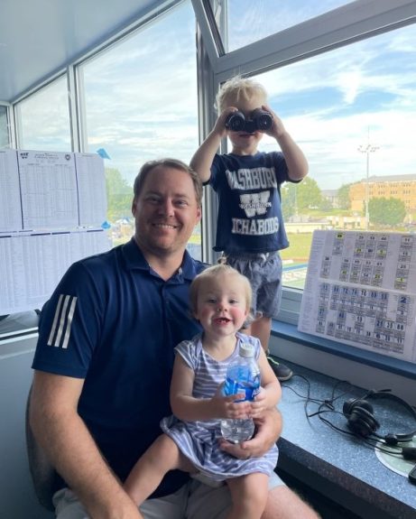 Washburn announcer Jake Lebahn with his children, Lawson and Brynn. Jake and his two children were in the broadcast booth at Yager Stadium.