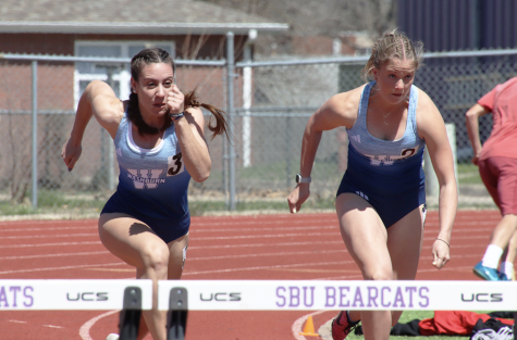 Naiuri Krein, freshman in pre-engineering, and Ashley Heavner, freshman in mass media, sprint toward the hurdles in the 100-meter hurdle event. Krein placed 10th in the event with a time of 15.51 seconds and Heavner placed 12th with a time of 15.94 seconds.