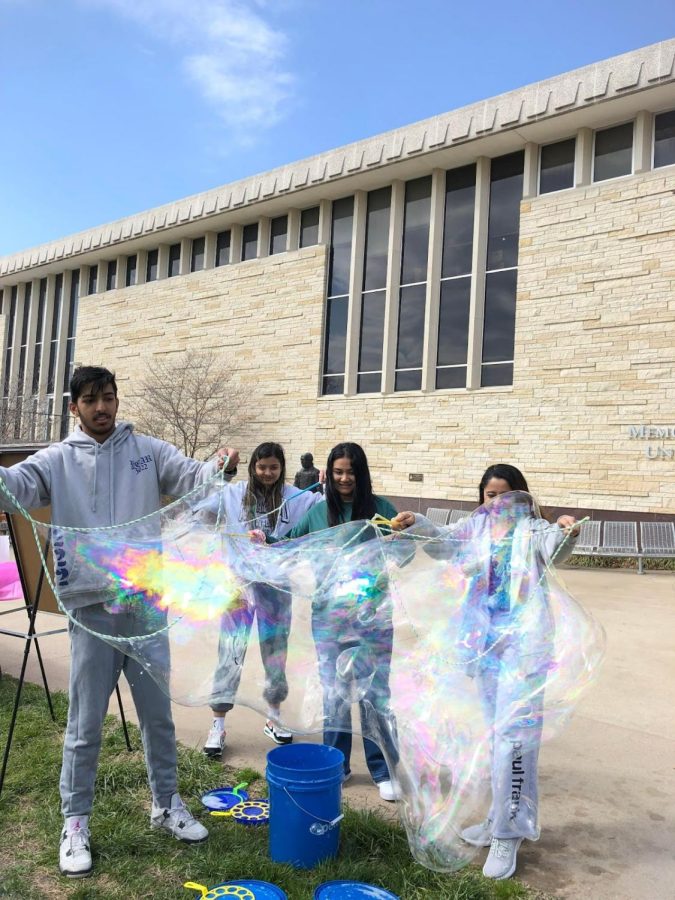 Spanish Sharma, freshman in computer science, Purnima Bhusal, freshman in nursing, Sneha Kharel, freshman in computer science and Samira Prasai, freshman in nursing, are in shock at the size of the bubble they made. The bubbles they made was one of the biggest bubbles made during the event.
