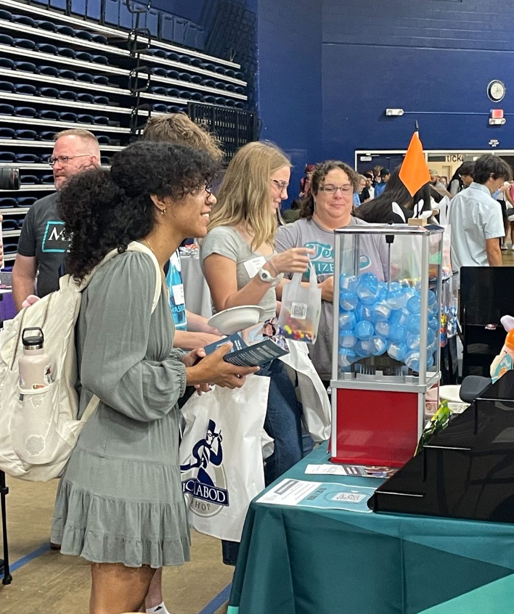 Mize gives away fun items to attract more students to their table. Students talked to the recruiters and earned a token to put in the machine for a surprise. 
