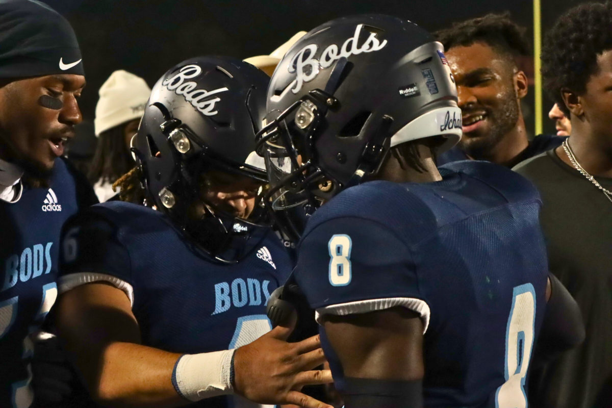 Ichabod players congratulate Bell on his 100-yard touchdown. They were happy to see the freshman get such a great play during the game.