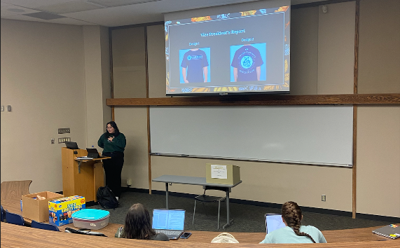 President Grace Loya, senior psychology and philosophy major, as well as president of the Psychology Club goes through the club meeting’s agenda. The members decided on their T-shirt collection for the club.