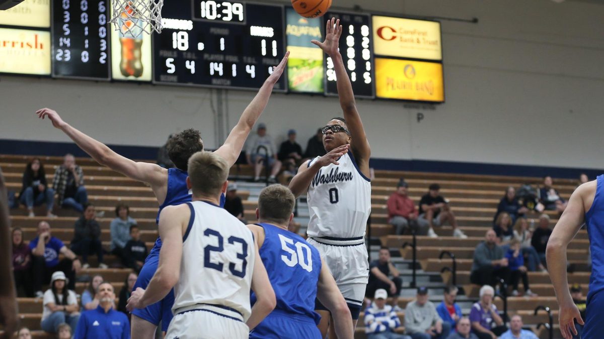 Sophomore forward Emmanuel Byrd takes a shot inside the paint. Byrd contributed eight points to Washburn’s total 82 points.