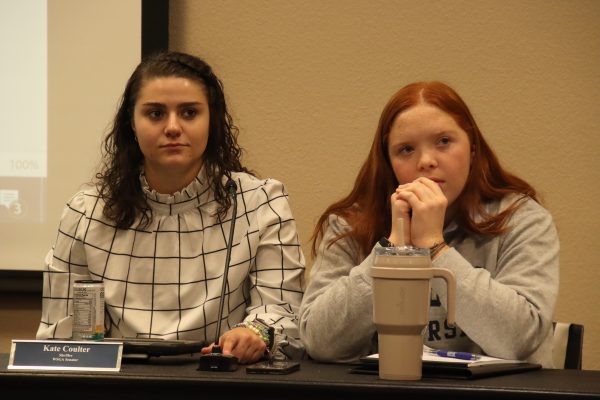 Kate Coulter, a sophomore in communications, and Maggie Bourell, a freshman in political science, listen to Herra talk. They considered what he was talking about and what he wanted to do around campus.