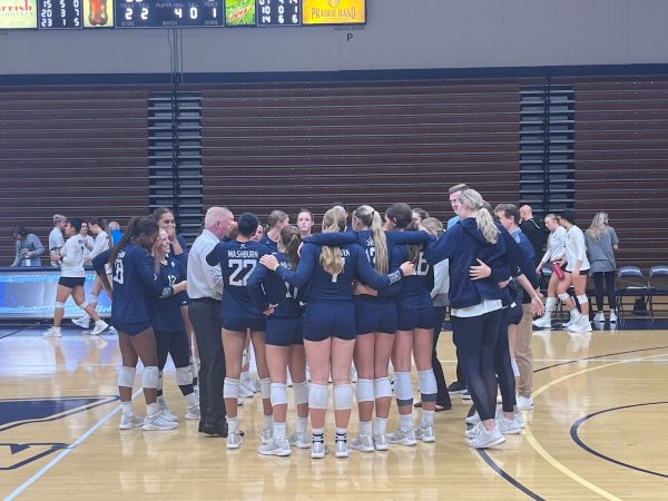 Washburn celebrates their win in traditional fashion. They won the match 3-1.