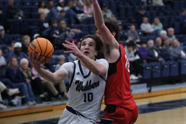Sam Ungashick, sophomore guard, rushes up to the basket and makes attempts to score. The Ichabods were leading against the Central Missouri Mules for the majority of the game. 