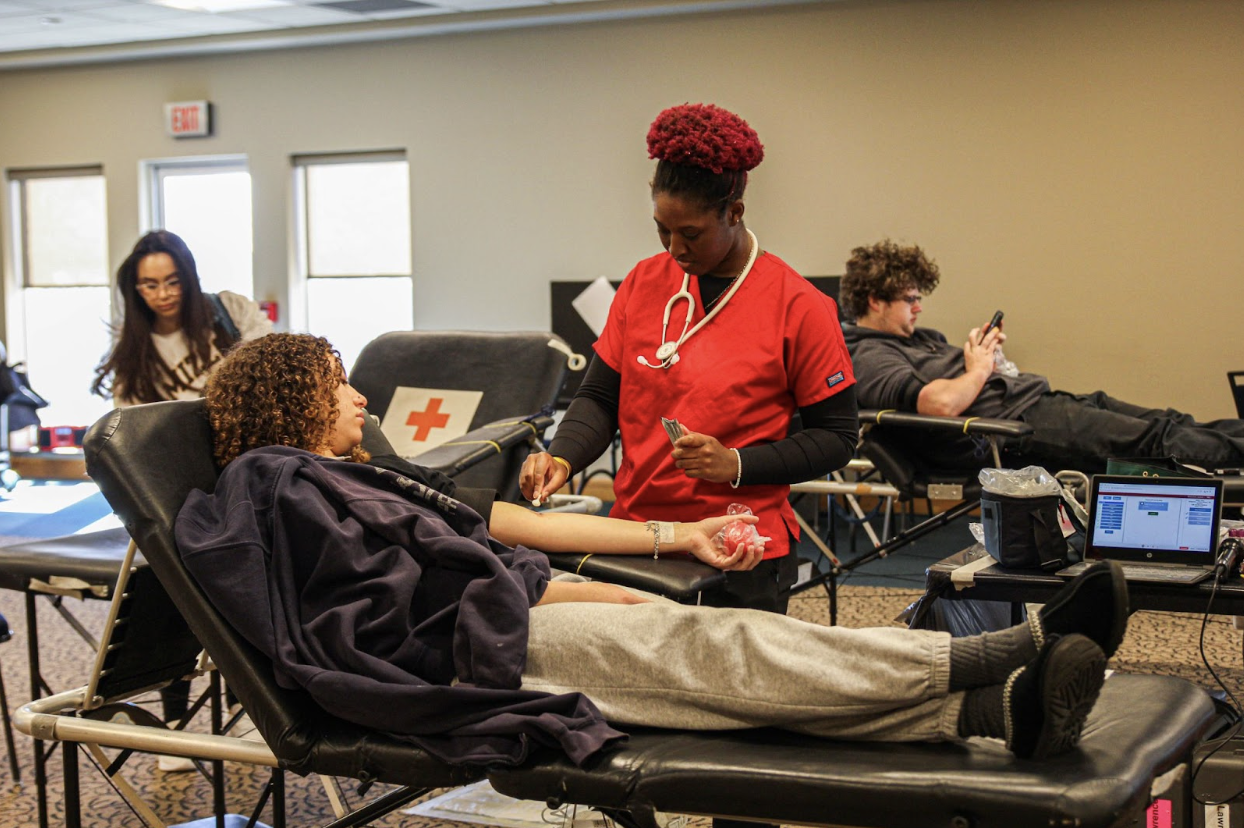While working with one of the Red Cross techs, participants get situated, get comfortable and get hooked up before the donation process. Some people feel uncomfortable about the ball squeezing technique because it uses arm power at the same time as losing blood.
