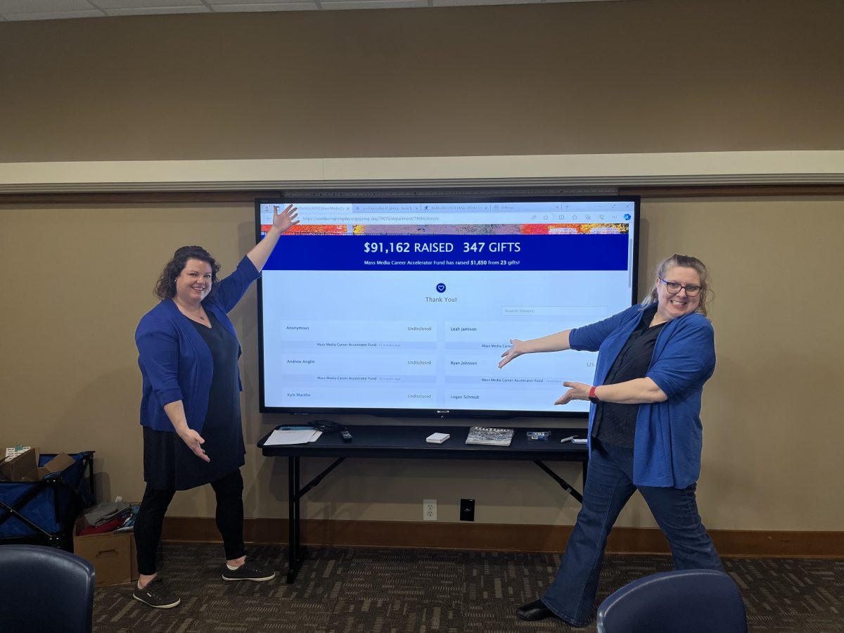 Kristen Grimmer, associate professor, acting chair  mass media and Regina Cassell Director of student media and senior lecturer, pose in the online front of the day of giving fundraiser dashboard. Over 450,000 dollars were raised by midnight on February 6, 2024