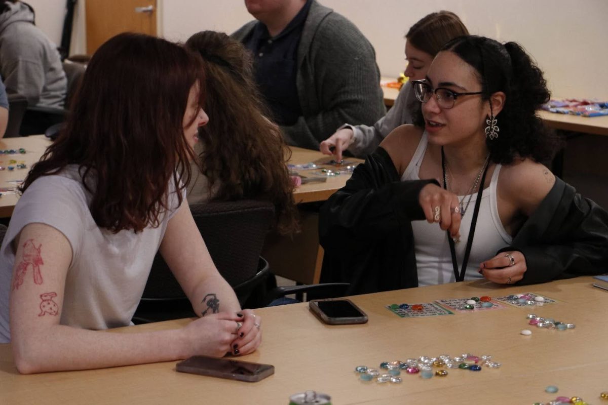 Vice President Hannah Whaley (left), sophomore social work major, socialized with an attendee while playing the game. She enjoys events like these as it encourages others to practice self-care.