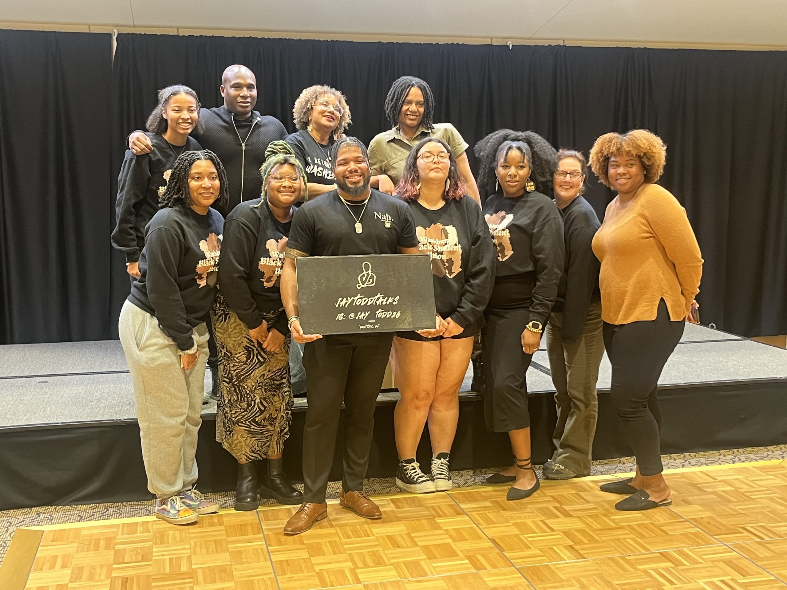 Members of the Washburn Black Student Union pose with guest speaker Jay Todd. Jay Todd is a life coach, DEI educator, mental health advocate and public speaker who was the keynote speaker during a banquet hosted by WSBU Feb 8.