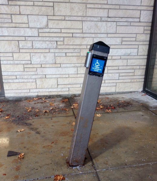 Handicap button bent outside of Henderson. That button opened Henderson’s doors if someone needed extra help. 