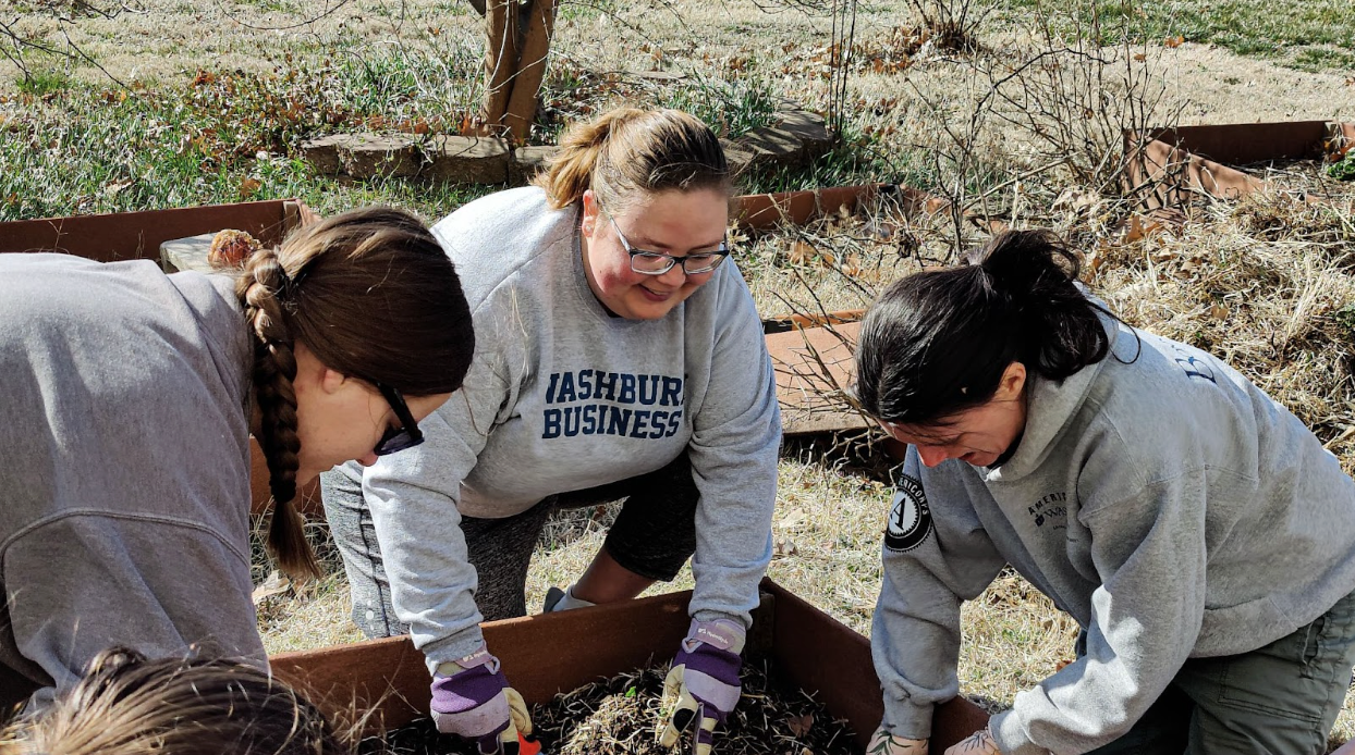 Emily DeShazer (middle), web specialist, is also the co-coordinator of the Washburn Community Garden. DeShazer shared that the items planted in the garden are going to the Bods Feeding Bods to serve the Washburn community freely.