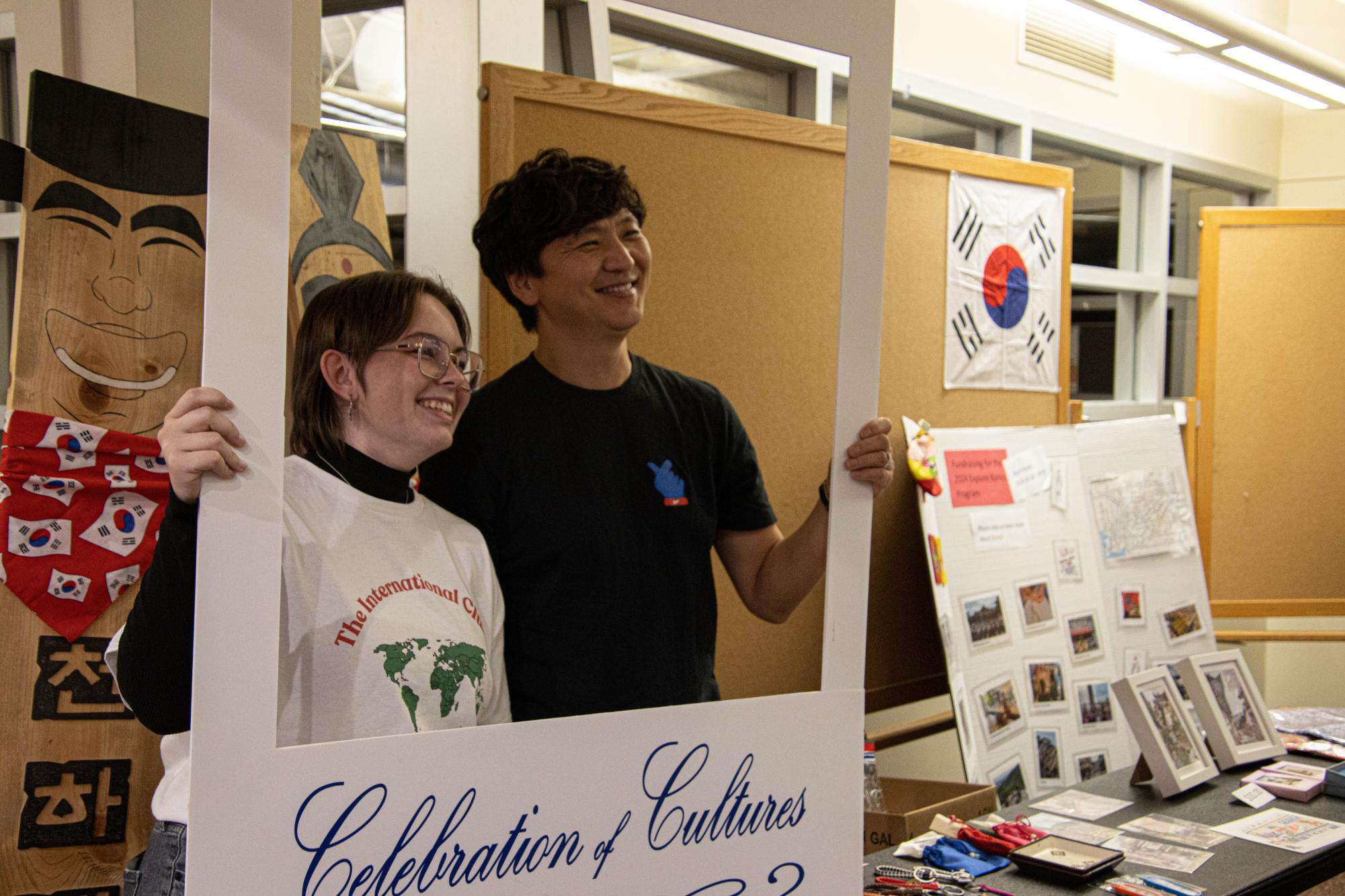 Park and Storm Henry, senior anthropology major, take a photo during the Celebration of Cultures event Nov. 16, 2023. The participants in the event were fundraising for the study abroad trip in South Korea this summer.