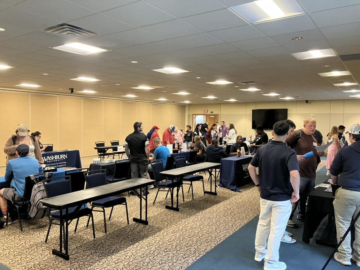 Students look around for job opportunities at the On-Campus Job Fair. Employers had tables for students to see what jobs they could apply for.