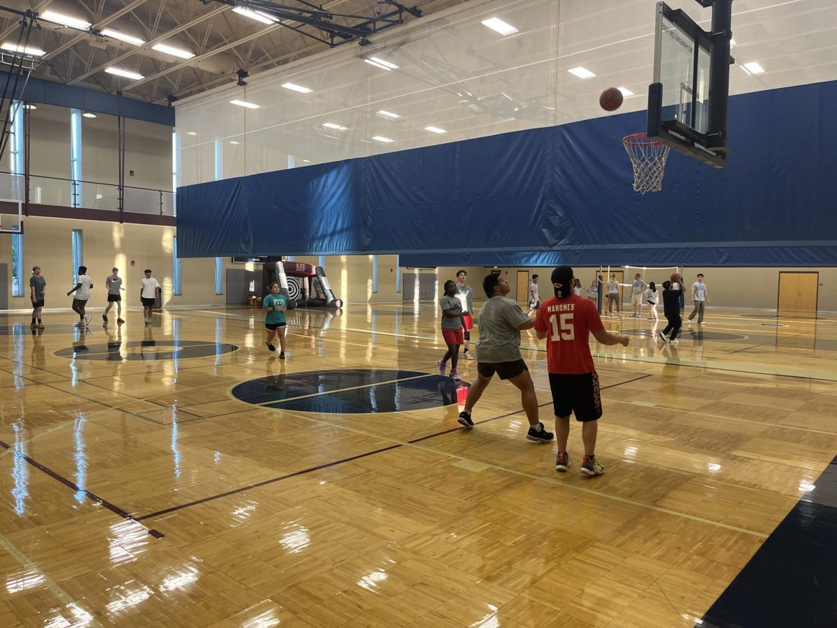 Students play basketball on the first court in the Student Recreation and Wellness Center. Students were involved in a number of activities for the full three hours.