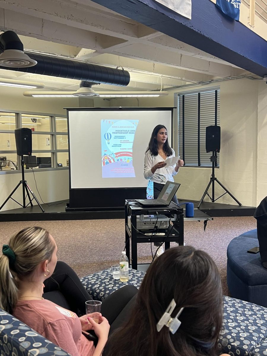 Aaradhya Shah, event coordinator and junior majoring in social work, gives short speech to enthusiastic attendees. The event was hosted by the Aleshire Center for Leadsership Leadership and Community Engagement.