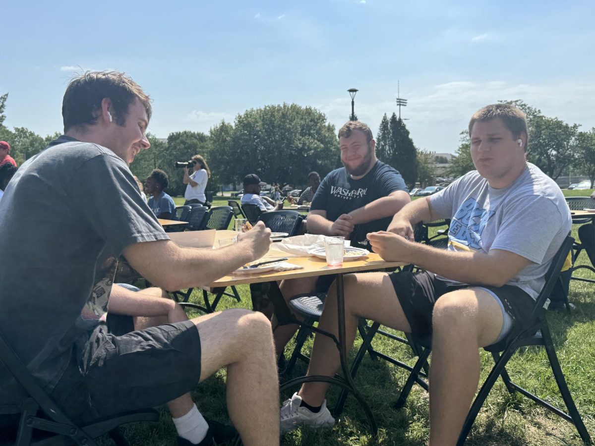 Ethan Matthias, senior political science major, Nathan Bearman, junior history major, and Grant Evenson gather together on the union lawn during the Luncheon. Many other students were on the lawn to enjoy the event.