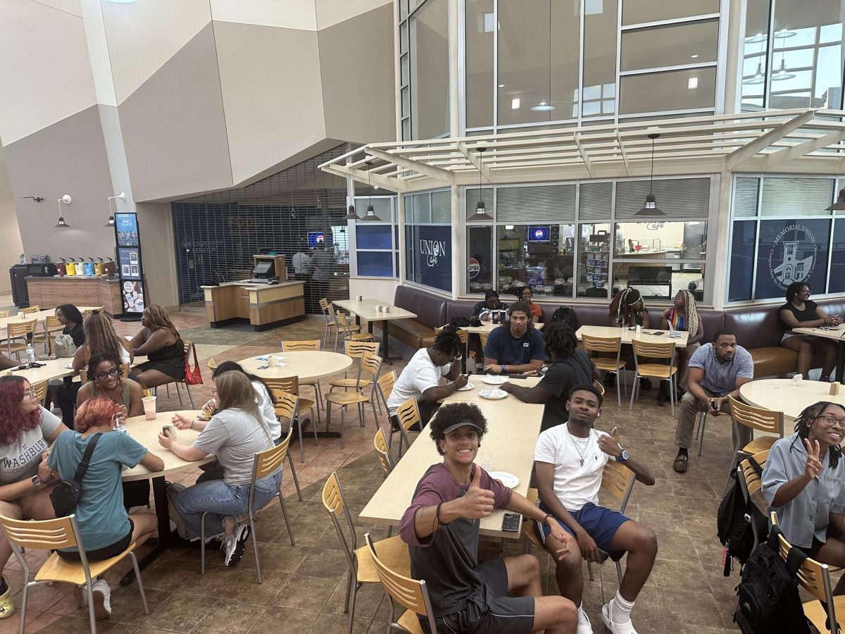 Dean Stewart, freshman forensic investigation major, and Arik Rolle, freshman physics major, are both attending the Black Student Union meeting and enjoying their time socializing. At this meeting, students learned about the organization and being part of the greater Washburn community. Photo courtesy of Sam DeLeon, freshman pre-medicine major.