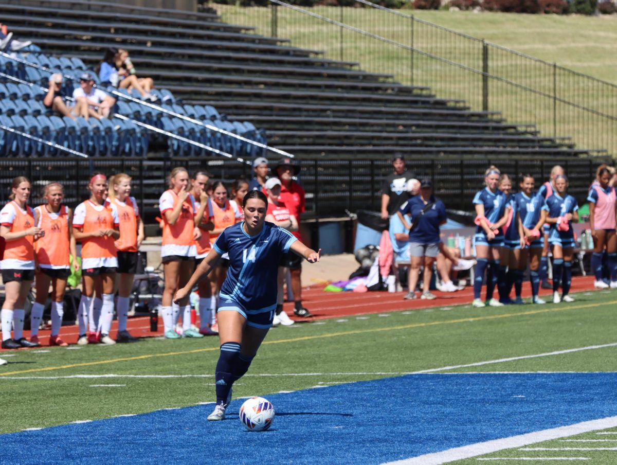 Lakin Rold, junior defender, makes her approach on a free kick. Washburn University lost the match 1-2.