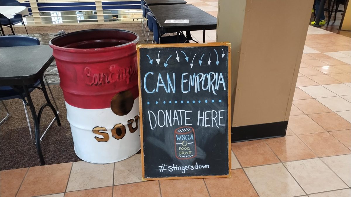 The giant Bods Feeding Bods red soup can sits just outside the corner store on the main floor of the Memorial Union at Washburn University, collecting donations for the annual Can Emporia competition. All proceeds benefit Bods Feeding Bods, the on-campus food pantry supporting students in need.