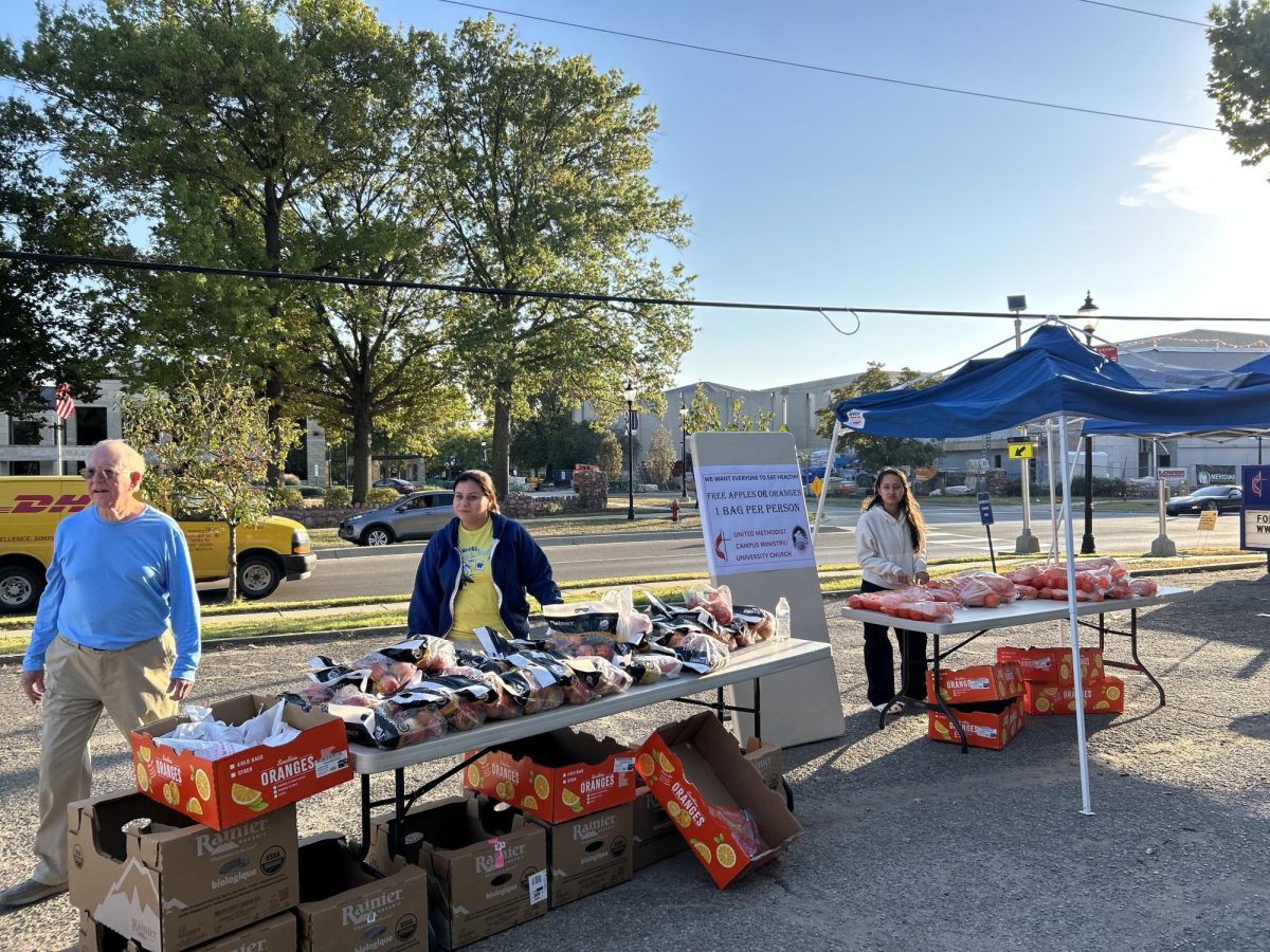 Volunteers at University United Methodist Church distribute oranges, apples and used clothing to support the local community. There was a Washburn band too.
