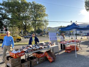 Volunteers at University United Methodist Church distribute oranges, apples and used clothing to support the local community. There was a Washburn band too.
