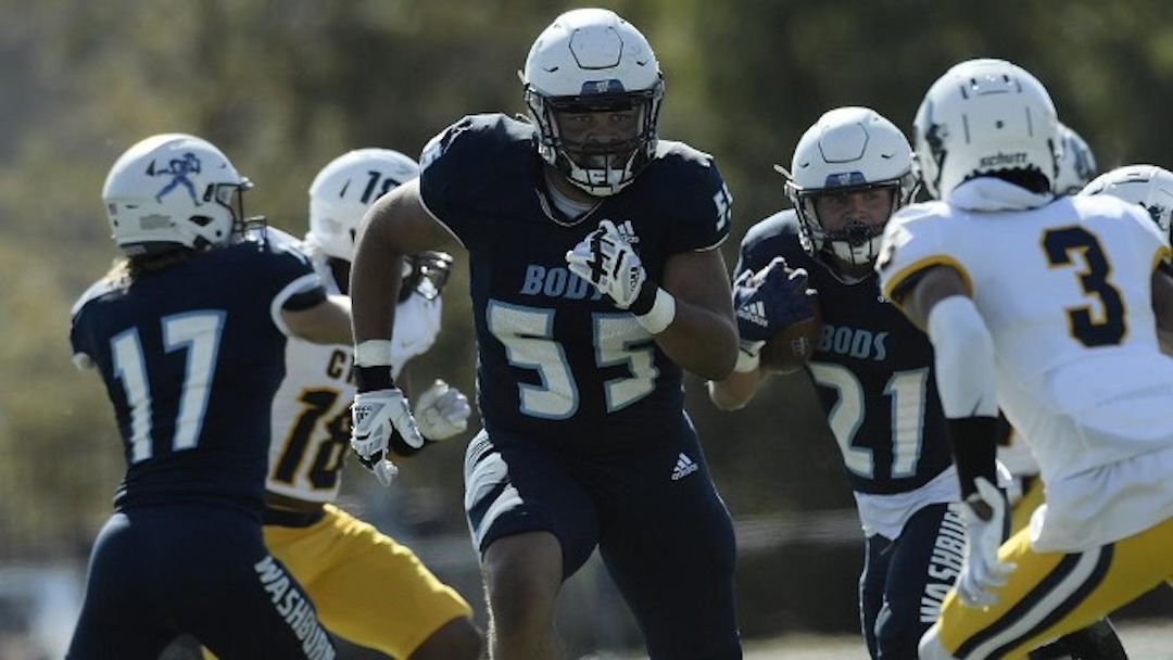 Number 55, CJ Murray, looks to make a big hit and free up space for his running back in a game against the University of Central Oklahoma. Murray was a offensive lineman for the Ichabods from 2018-2023, getting caught up in the COVID years.