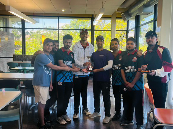 Both the teams pose for pictures with the winning trophy although the winner hasn’t been decided yet. The Washburn cricket team is looking forward to the next match.