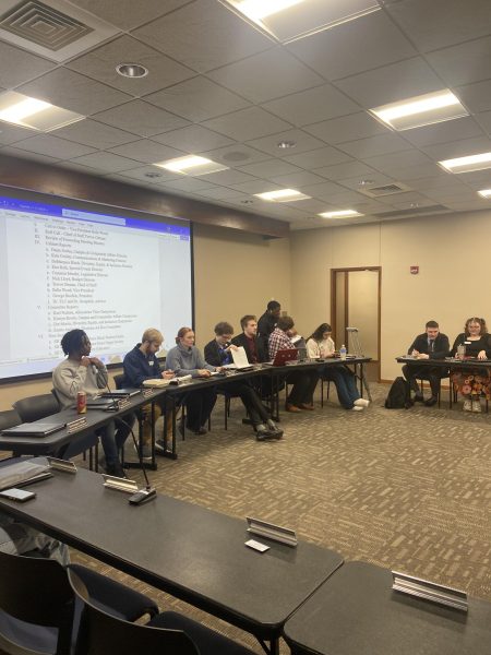 The Washburn Student Government Association members gather around before the meeting. The meeting discussed plans for Success Week, International Education Week and many other upcoming events.