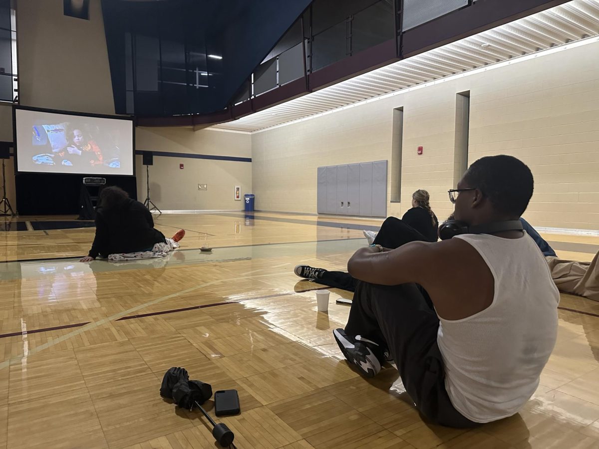 Students watch a movie at the Halloween Movie Night event hosted by the Student Recreation and Wellness Center. The movie was “Hocus Pocus."