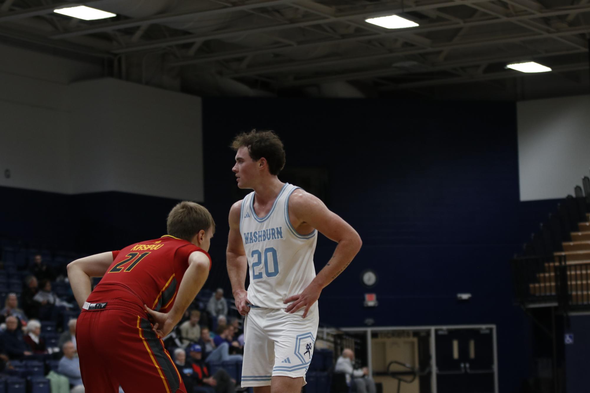 Pittsburg State player guards Shorter as he looks for the ball. Shorter secured 15 points in the game.