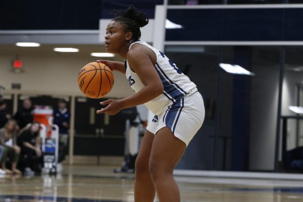 Amaya Davison, junior guard, showcases her dribbling skills. She was putting in the effort and energy to score.
