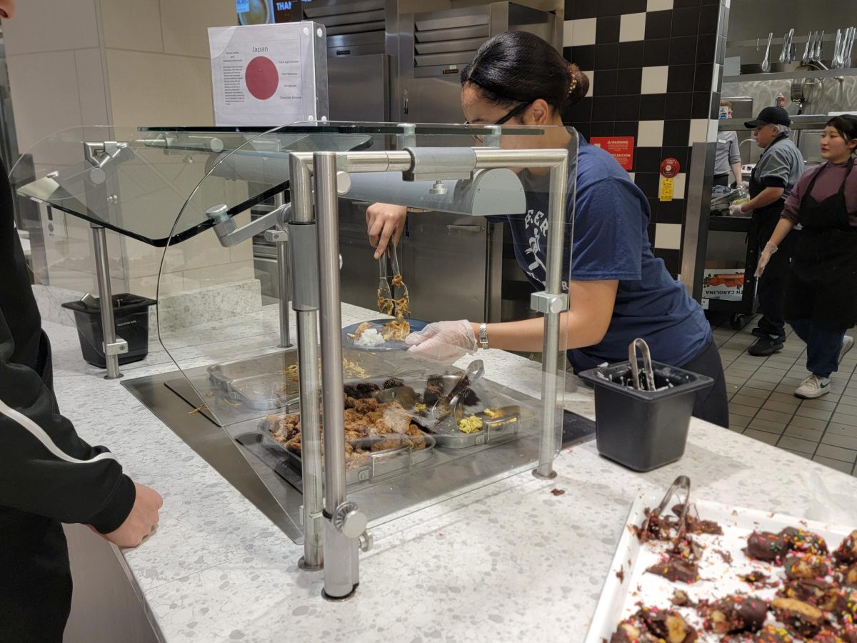 Nishimura serves food. She would later say she wished they had prepared more pork Yakisoba (noodles) because of how fast they were eaten.