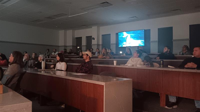  Nikki Jackson enjoys the film with her family. The audience were intrigued by the film while eating traditional native American snacks.
