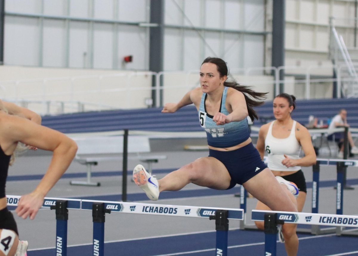 Kaylee James, junior hurdler, jumps the hurdles. James finished the race in second place with a time of 9.16 seconds.