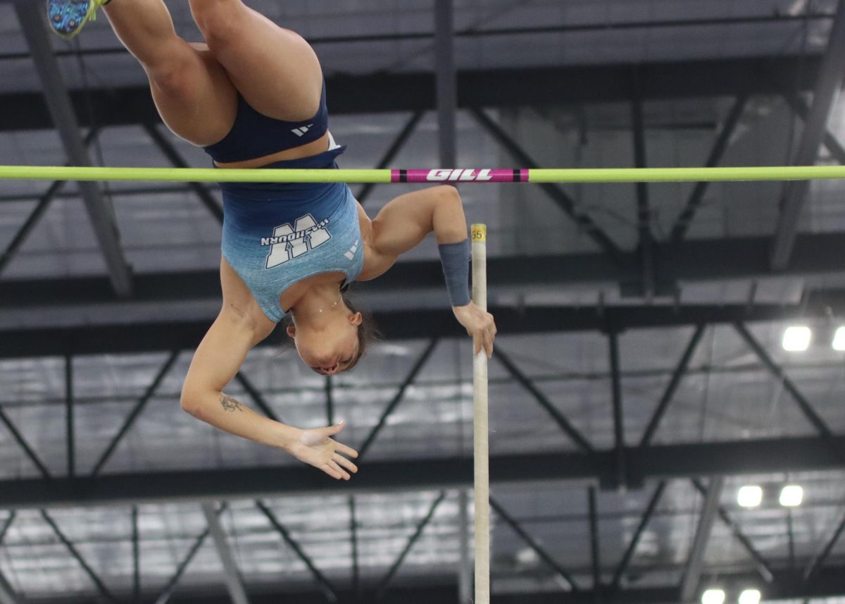 Isabel Demarco de Quadros, freshman jumper, vaults over the crossbar. Quadros finished the meet not only in first place in the women’s pole vault at 4.16 meters, but gained a personal record, NCAA provisional and tied with Washburn University’s women’s pole vault record.