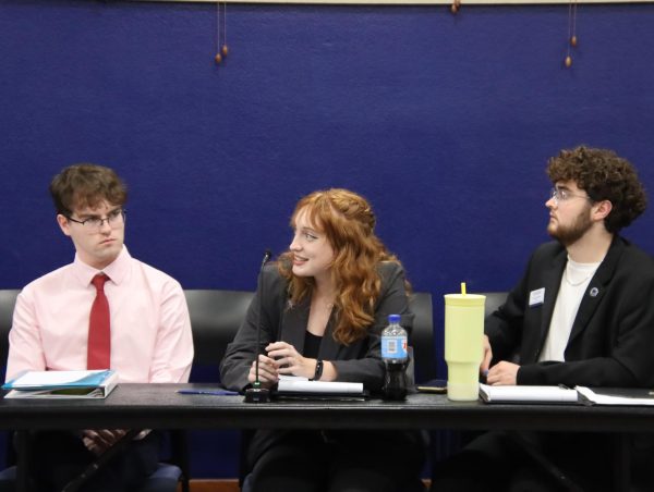 Ethan Clark, senator (left), Tiana Smith, senator (middle), and Colton Cattoor, senator (right), hold discussion during the senate. WSGA is suspending all student grant requests until July 1.