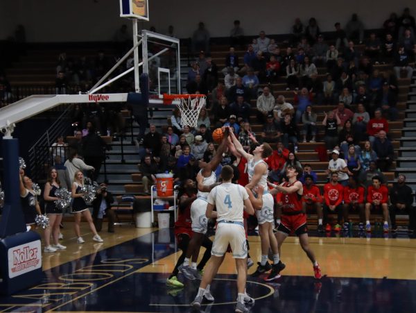 Brady Christiansen, junior forward, and Hanna prevent UCM from scoring a point. Ichabods held the Mules to 26 points in the first half.