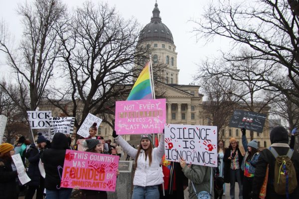 College students from across Kansas traveled to Topeka just so they could participate in the march and protest their beliefs. Wichita State University students Tyler Naquin and Keegan Maxfield stood with Washburn student Abigail Nelson holding signs high for anyone driving by to see. 