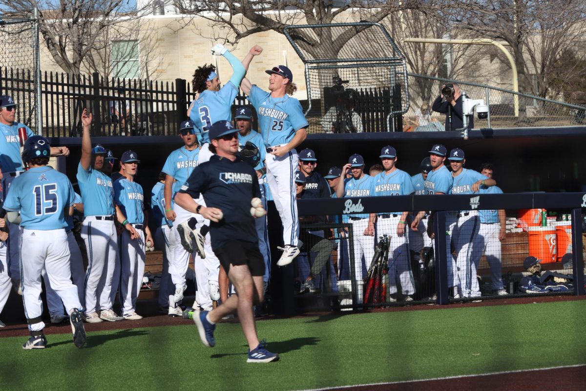 The Washburn bench celebrates after Jett Buck, senior utility, hit the second home run of the inning to dead center field. After this, the Ichabods held a 5-3 lead.