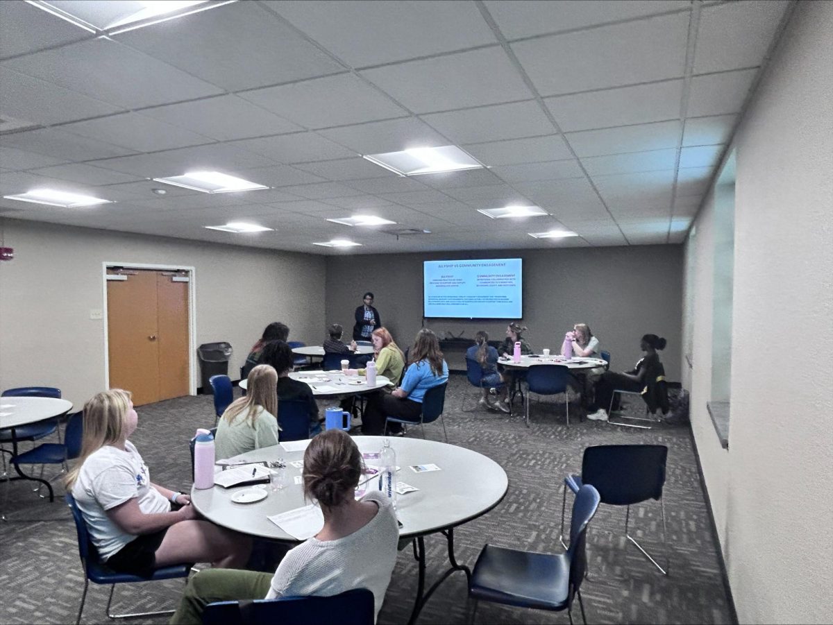 A whole view of the Vogel room, where students focus on the board and listen to the presentation. This event highlighted the necessity of such an event for Washburn students to learn about becoming conscious individuals before entering the workforce.
